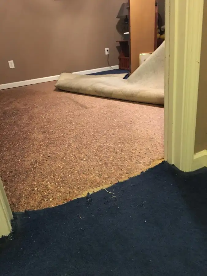 Carpet pad removal revealing water damage during Drying & Dehumidification in McFarland